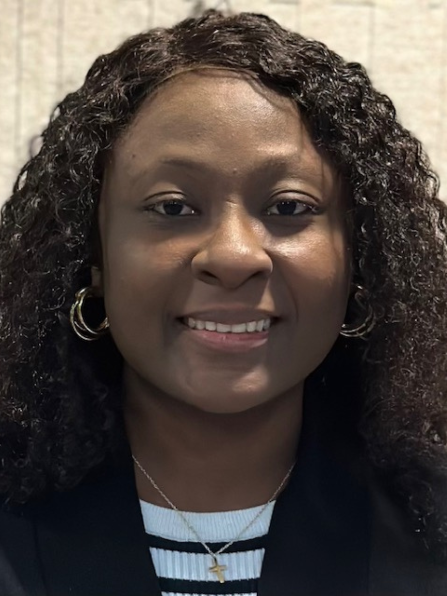 A headshot of Taiwo Rebecca Alawode smiling.