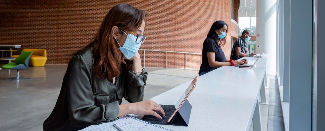students wearing masks studying