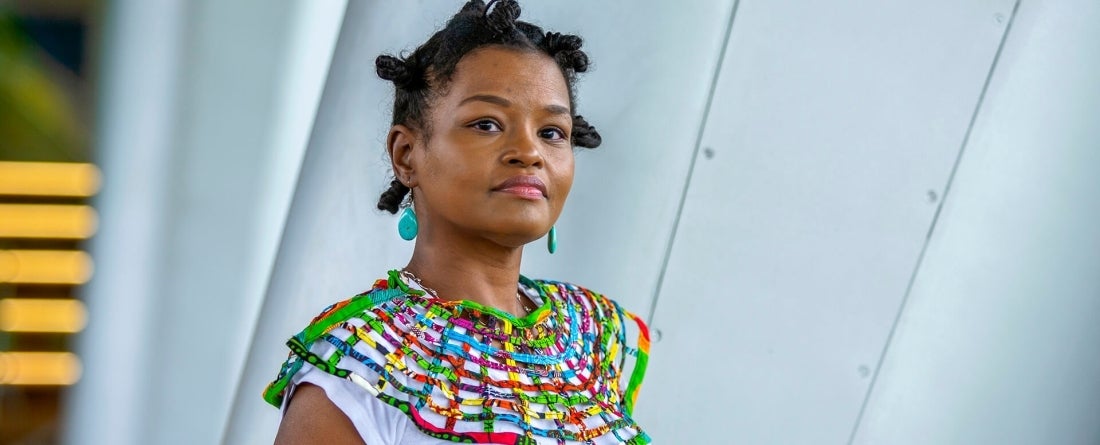 Aisha Washington looks confidently into the camera