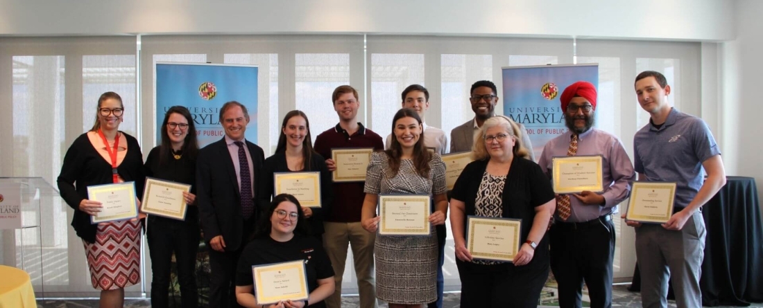 image of celebration of service award winners holding certificates