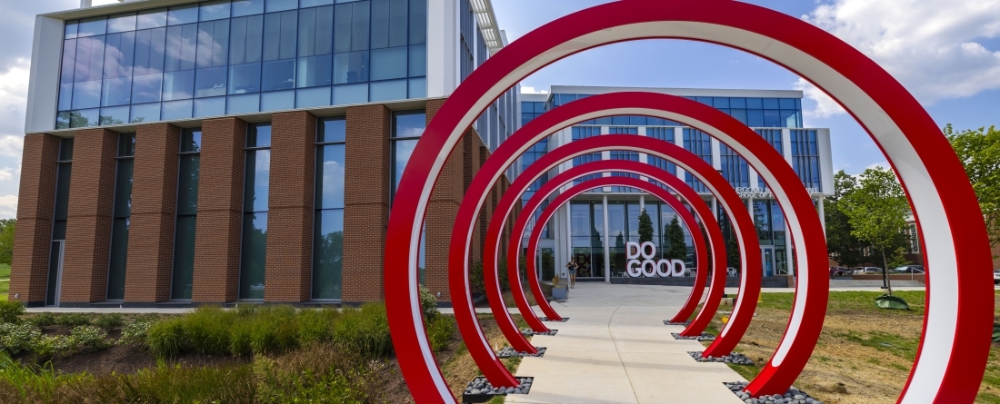 Five red 12" sculptural rings leading up to Thurgood Marshall Hall in background