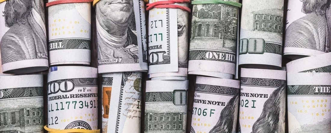 image of US dollars rolled up