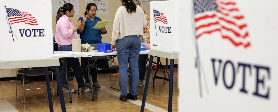 people voting at a voting booth