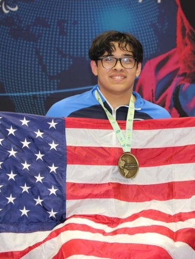 Noah Hanssen holding an American flag