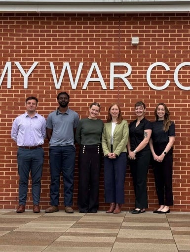 Group of students in front of the U.S. Army War College sign